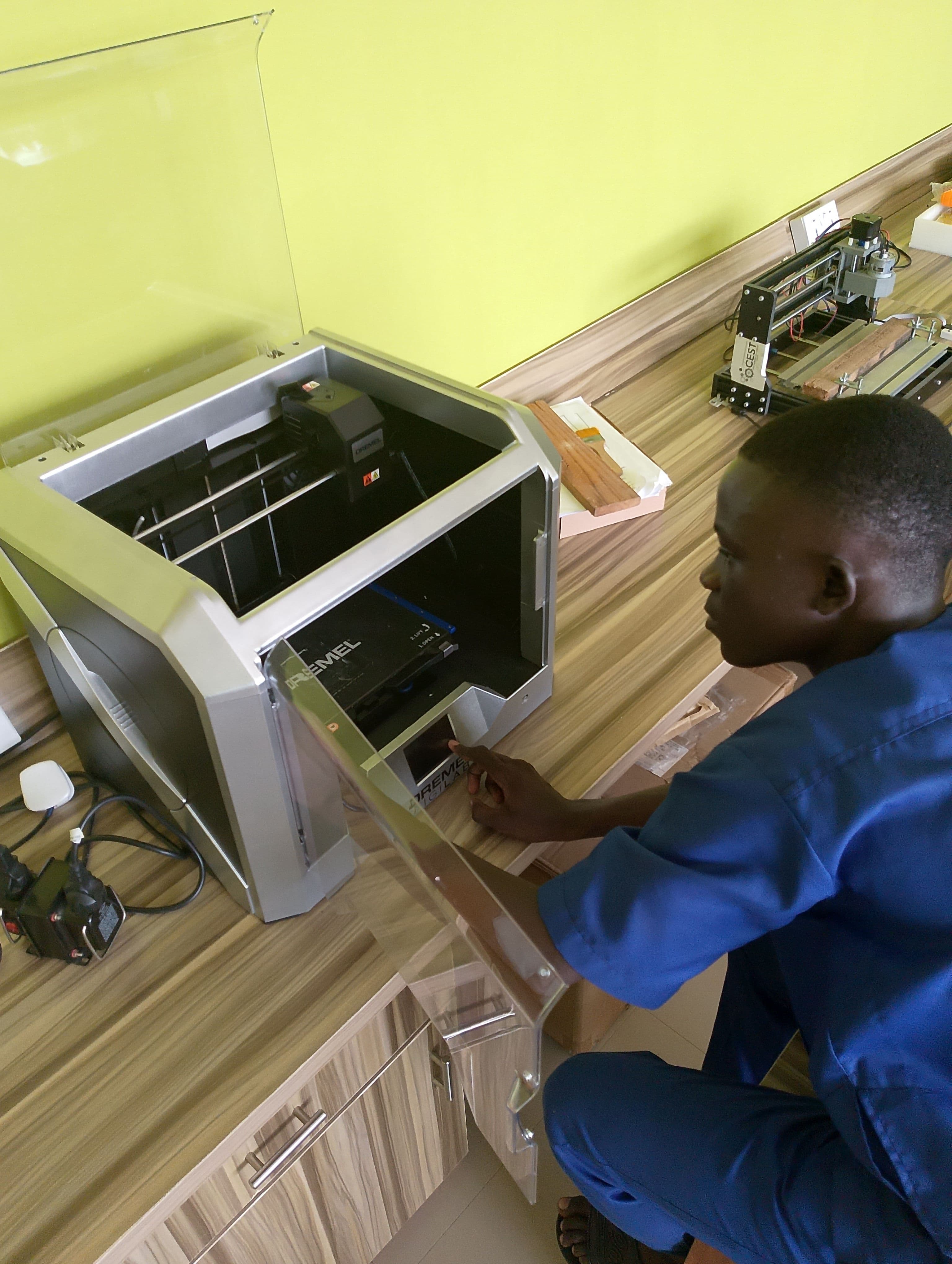 Oladipo Caleb Olugbenga observing a device